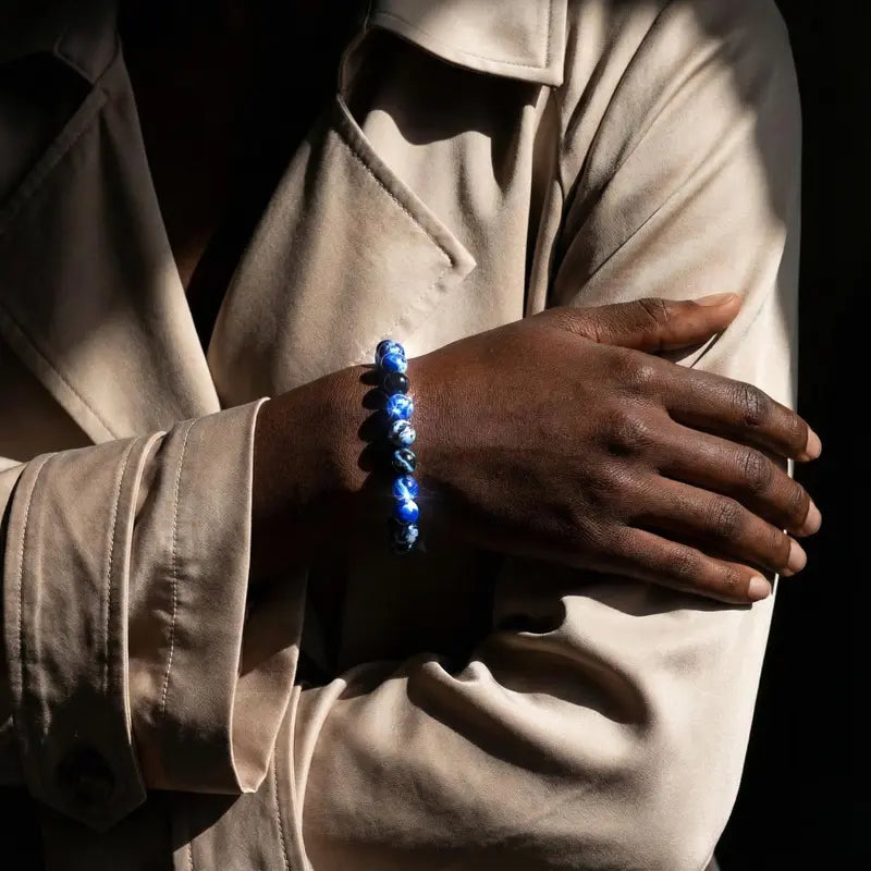 A Blue Fire Agate bracelet, possessing protective properties and benefits for memory.